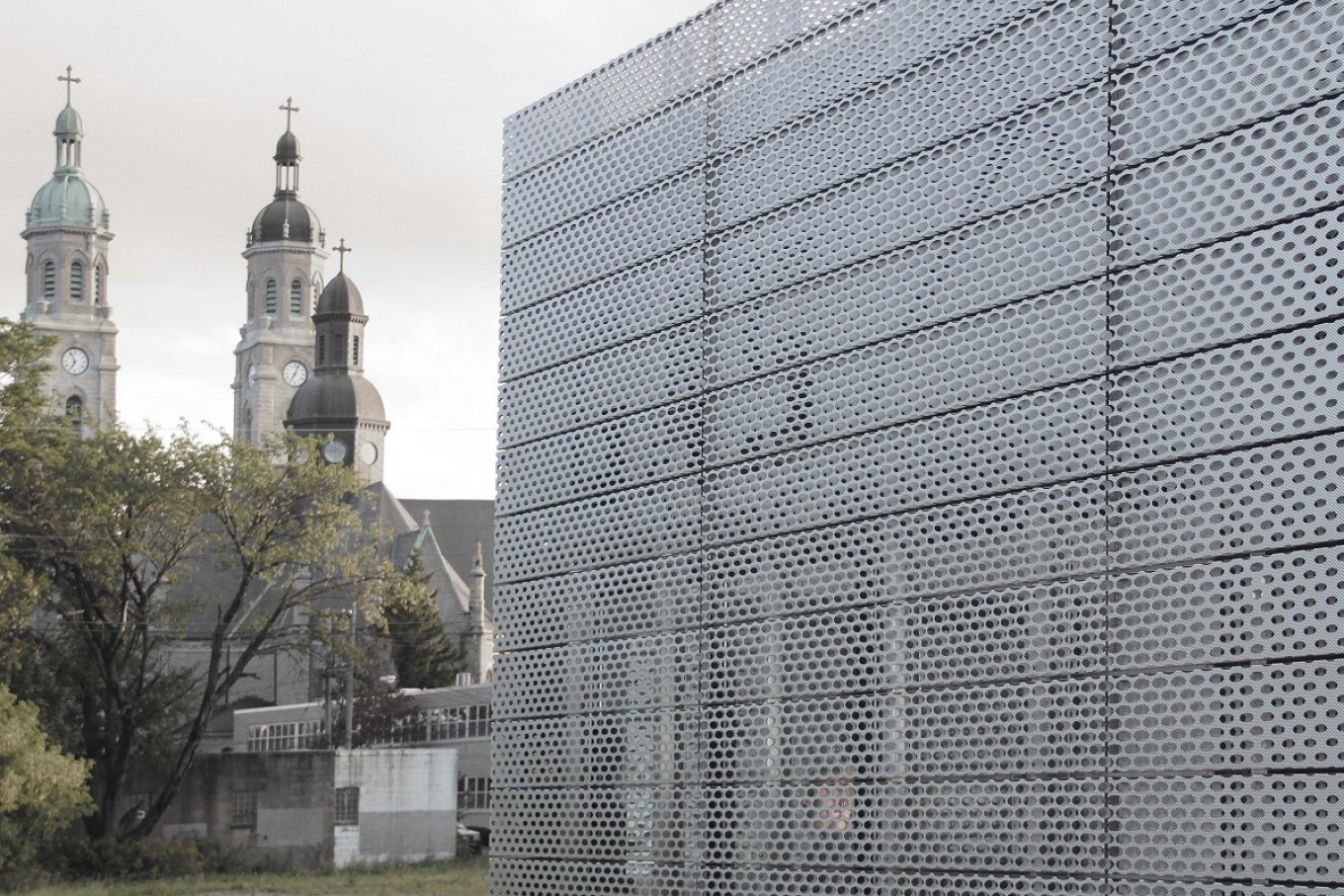 Light/Station, with St. Stanislaus Roman Catholic Church in the background. 
