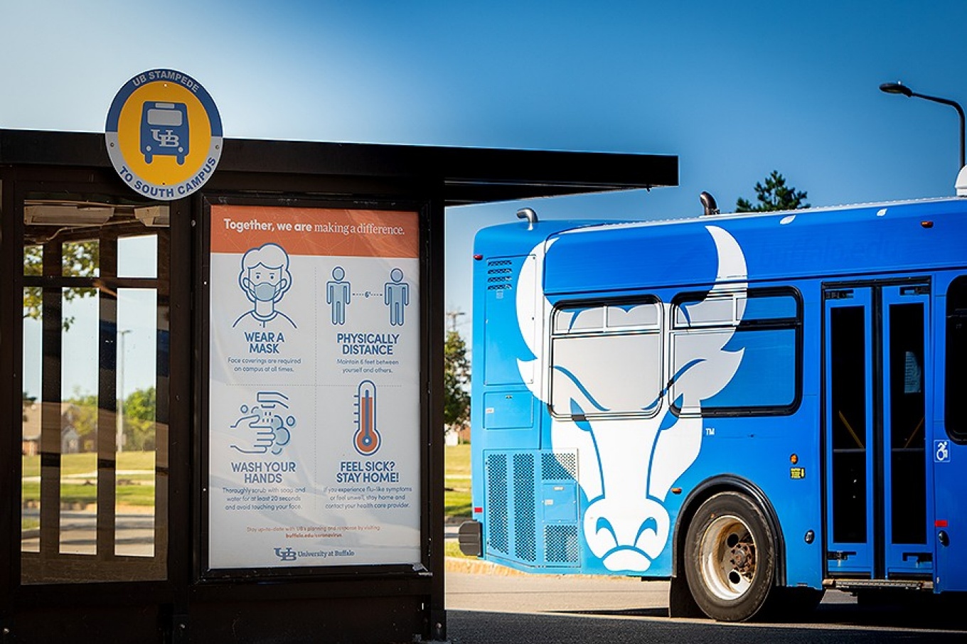 Signage designed by University Communications for the public education of best COVID-19 health practices and rules posted on the bus stop shelter at the Flint Loop on North Campus. 