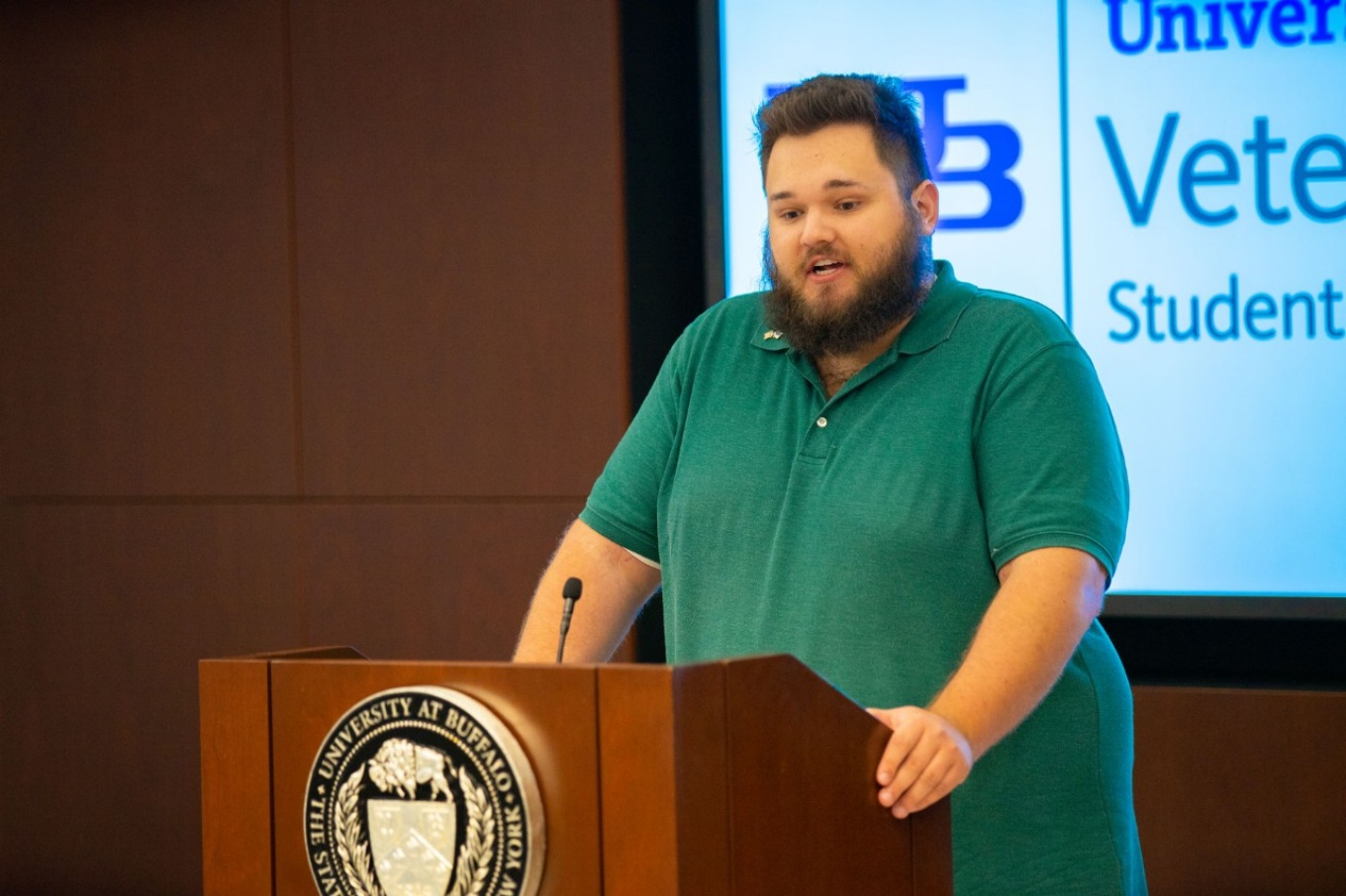 Justin Downey at a podium. 