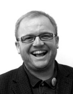 headshot of Gregory Delaney. 