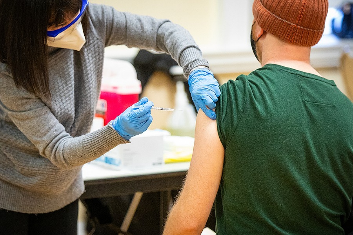 A person receives a COVID-19 vaccination. 