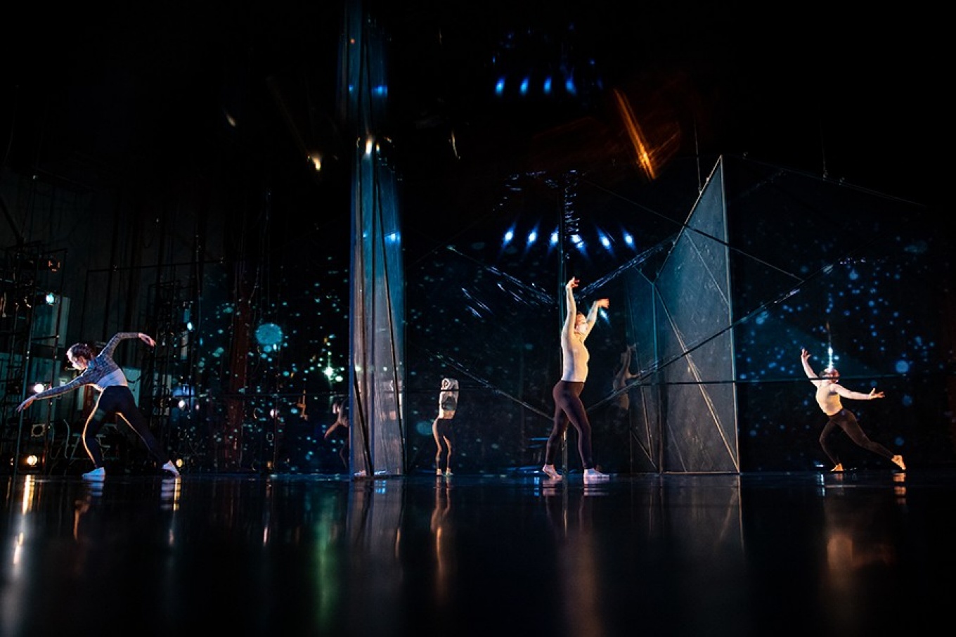 Dancers performing on stage. 