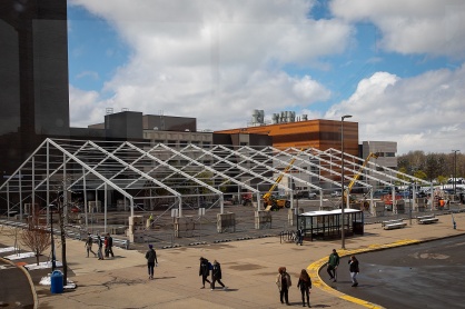 Zoom image: The tent starts to take shape in the Furnas parking lot. 