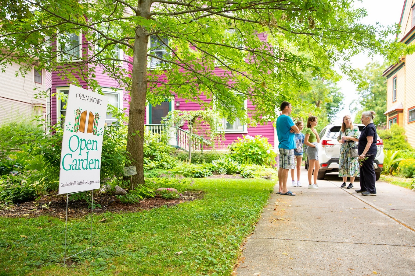 Zoom image: Pamela Rose (right) greets her first visitors outside her home on Woodward Avenue in Buffalo's Parkside neighborhood. 