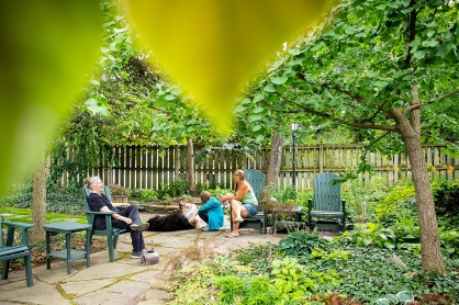 Zoom image: Rose laughs during a conversation with the Klein family, who visited her Open Garden hours in July. 