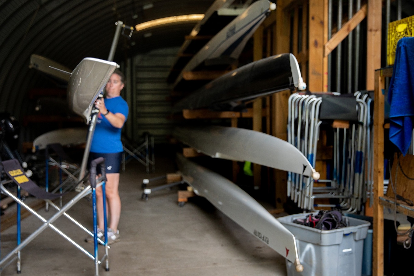 Zoom image: Barnum stores her scull at the UB boathouse in Amherst Veterans Canal Park. She carries the boat to the creek balanced on her head. 