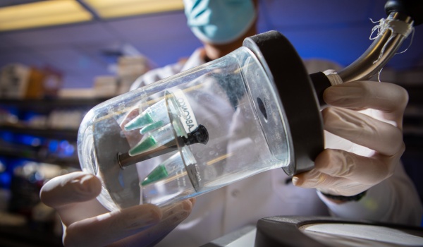 Zoom image: A vacuum chamber holds ingredients of a liposome-based vaccine that could be developed for COVID-19. Photo: Douglas Levere 
