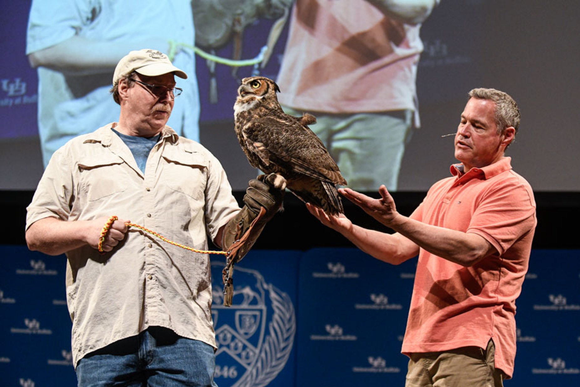 Zoom image: Jeff Corwin (right) shows off a great horned owl from a local wildlife rescue organization. Photo: Joe Cascio 