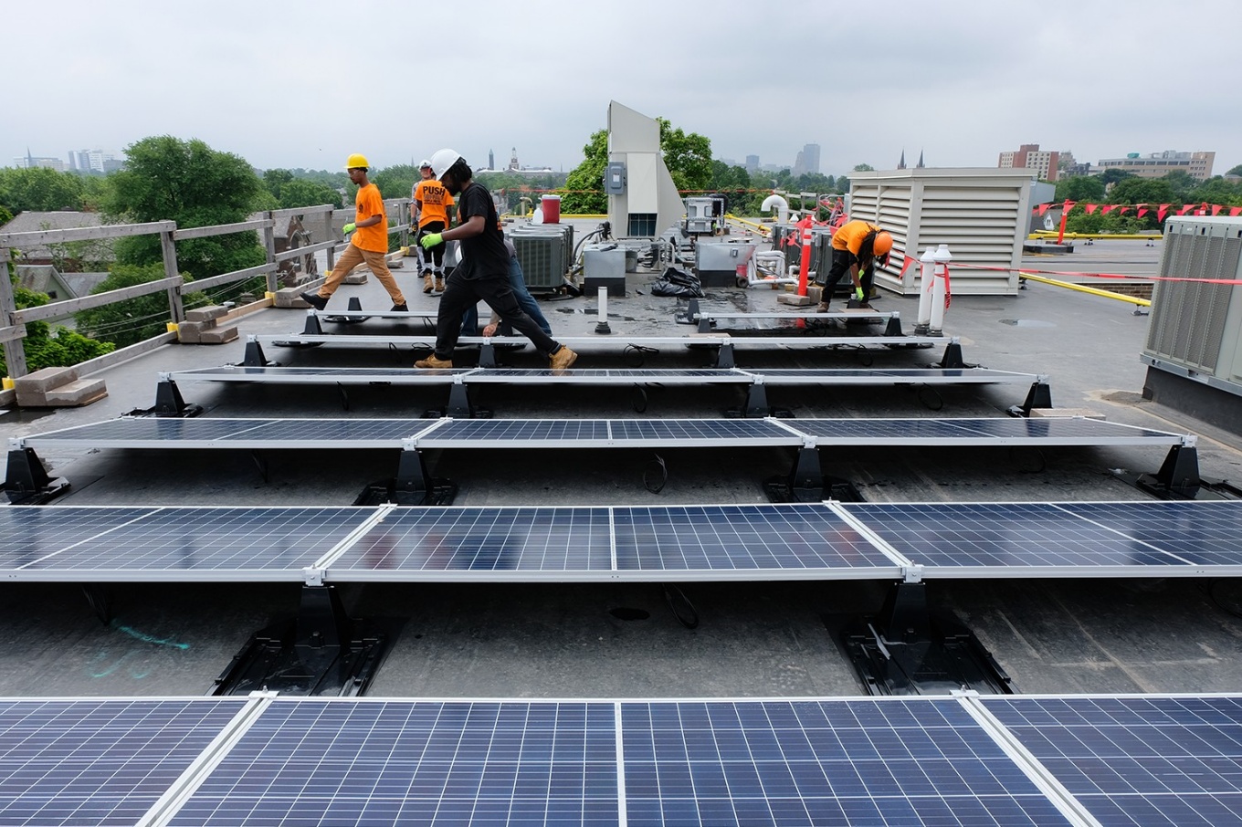 Zoom image: Local energy efficiency and clean technology jobs will pay workers a living wage, allowing them to support a family while boosting the local economy. 