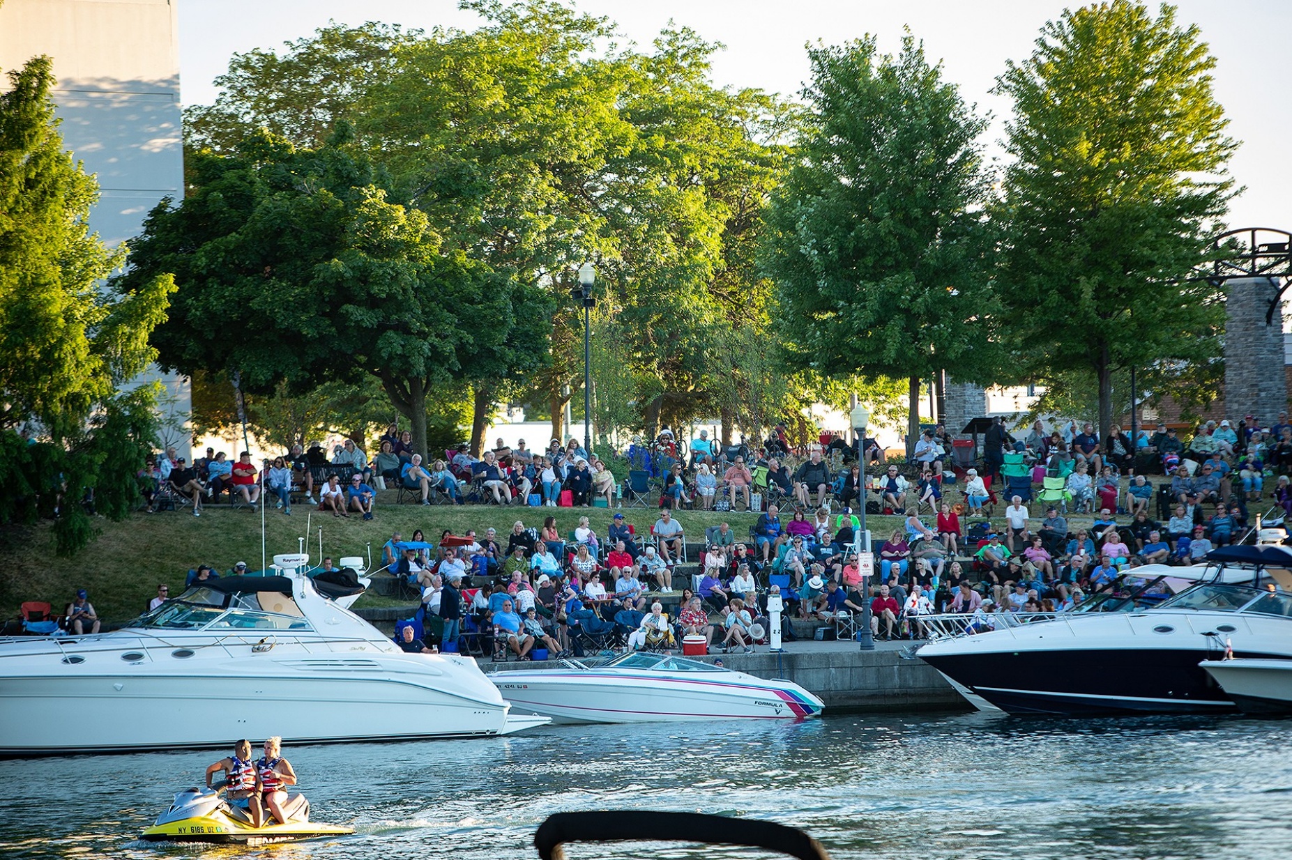 Zoom image: More than 5,000 people were estimated to have attended this show. Along with the immediate stage area, people set up in the shade across the Erie Canal, and listened from boats as well. 