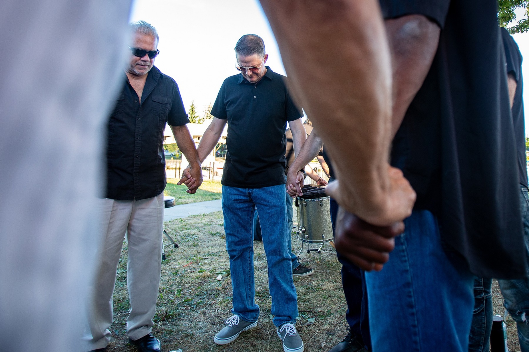 Zoom image: The full band gathers for a moment of prayer before the show. They call it &quot;the circle.&quot; 