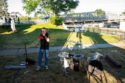 Zoom image: Mauck uses a mute system — the red filter on the end of his trombone — so he can play full out without much sound coming out. 