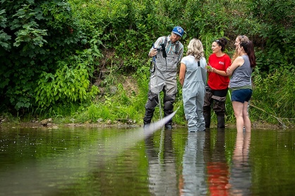 Zoom image: Participants compare their results with those of the acoustic doppler flow meter. Photo: Meredith Forrest Kulwicki 