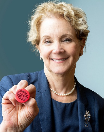 Zoom image: Allison Brashear holds a pin that reads, &quot;Don't tell me what to do with my own body.&quot; Photo: Sandra Kicman 