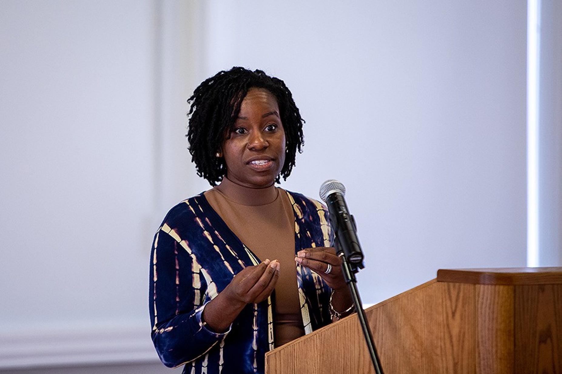Takesha Leonard speaking from a podium.