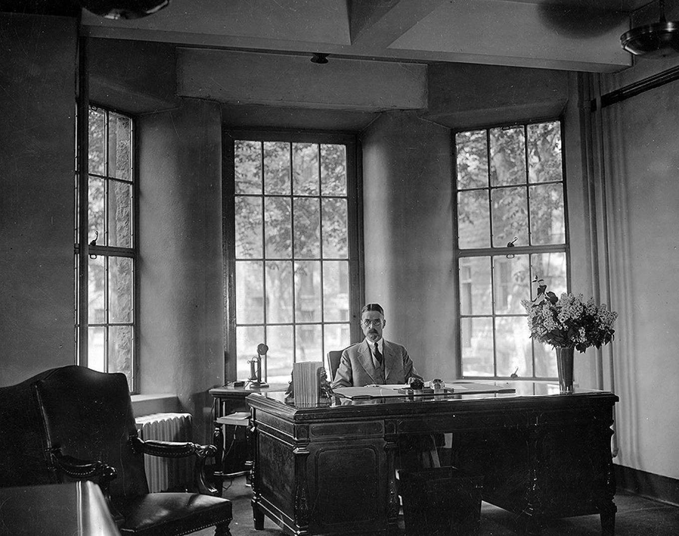 Samuel Capen pictured sitting at his desk. 