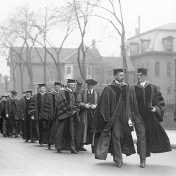 Samuel P. Capen (left) and University of Buffalo Council Chair Walter P. Cooke (right) lead the academic procession to Capen&rsquo;s inauguration. 