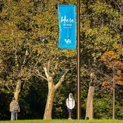 Students walking on campus during the fall. 