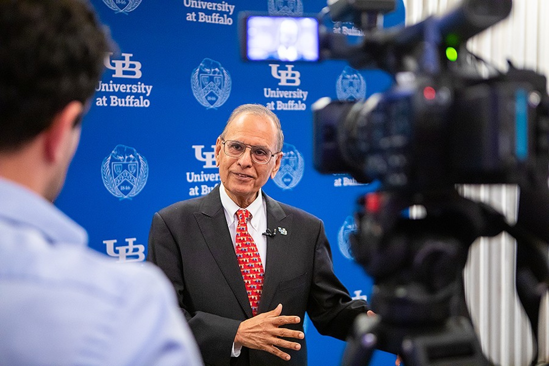 President Tripathi speaks with members of the media following his State of the University address. 