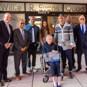 UB administrators and Willie Evans' family members pose at the front door of the Willie R. Evans Quad. 