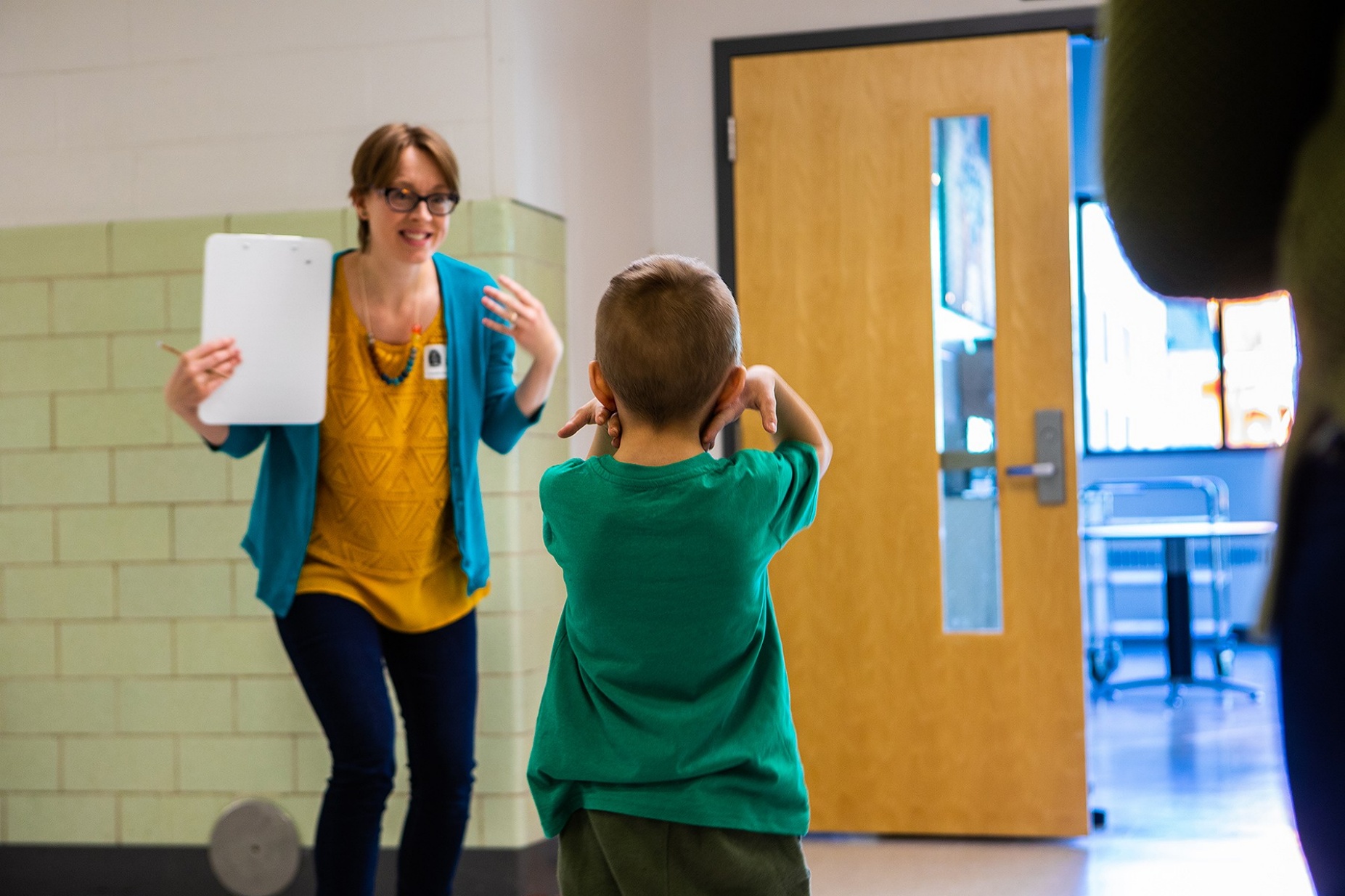 Zoom image: Claire Cameron, associate professor of learning and instruction, leads an assessment. The students were tested on their ability to self-regulate before and after taking part in the study to evaluate the effects of the curriculum. 