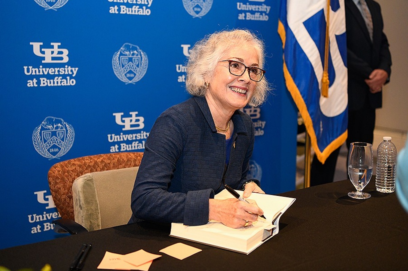 Marie Yavanovitch signs a book during her Distinguished Speakers Series appearance. 