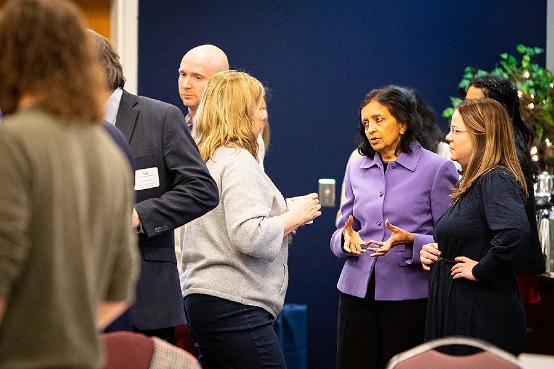 Chitra Rajan, PhD, associate vice president for research advancement, at center, speaks with attendees at the Hydrogen workshop. 