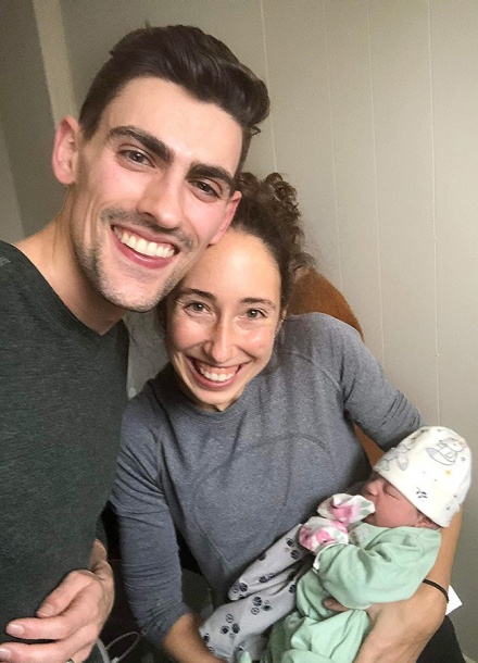 Zoom image: Anthony Burdo and Tatum Burdo with baby Alaiya, who they helped deliver from a stormbound mother on Christmas Day. 
