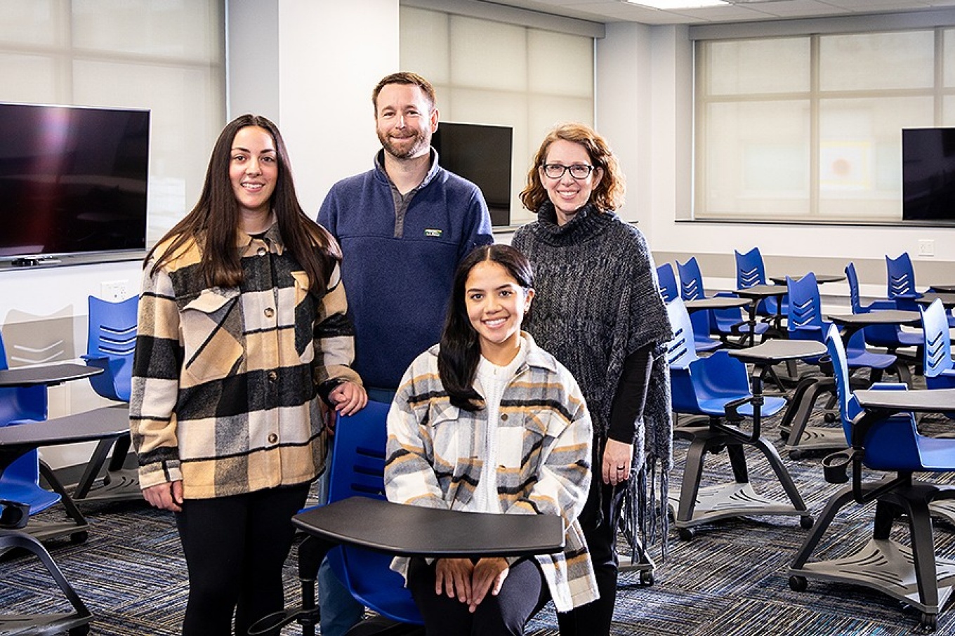 From left, Sarah Moreno, Health service administration mph program; Brandon Kuhn, project administrator; Leslie Mendoza, advanced graduate certificate in public health (seated); Kimberly Krytus. 