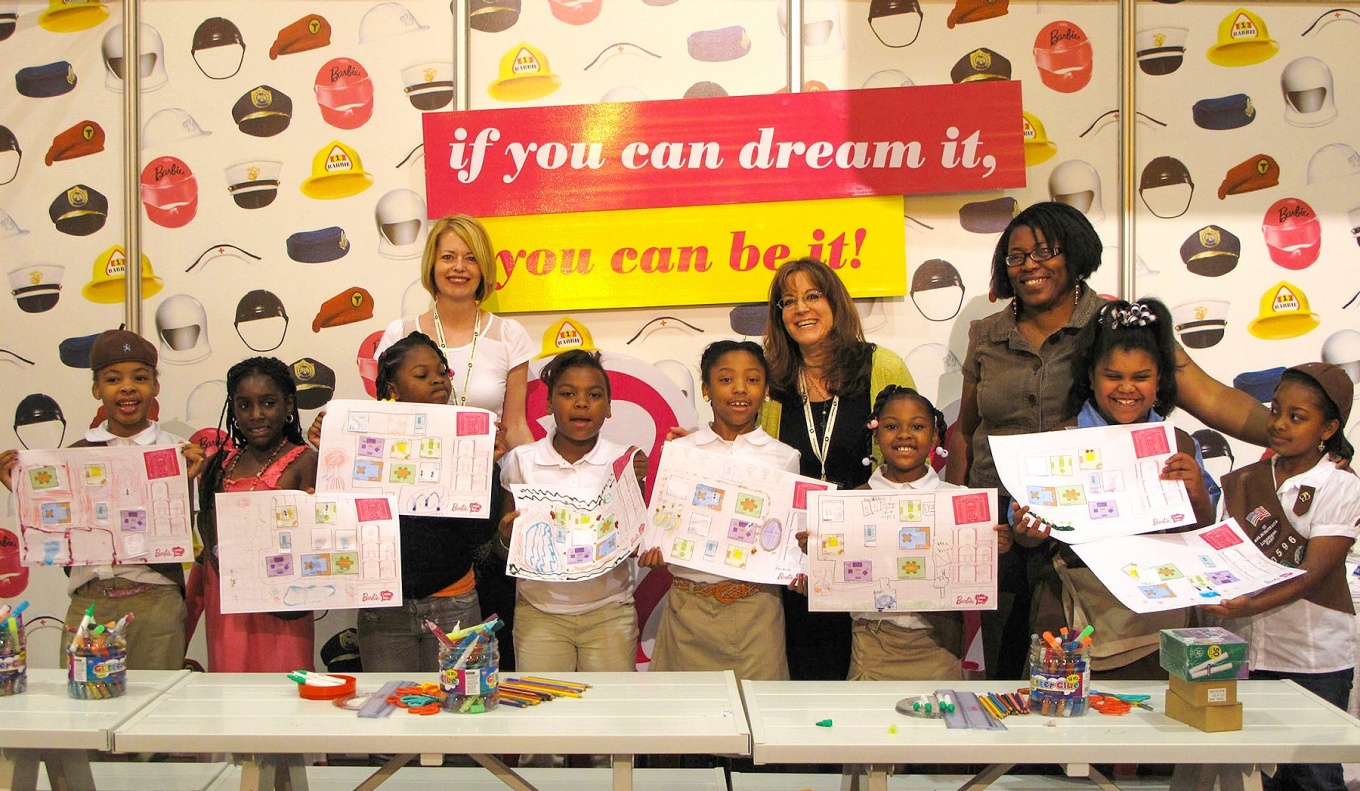 Kelly Hayes-McAlonie and Despina Stratigakos pictured with a group of young girls who were working on an Architect Barbie-themed activity in 2011. 