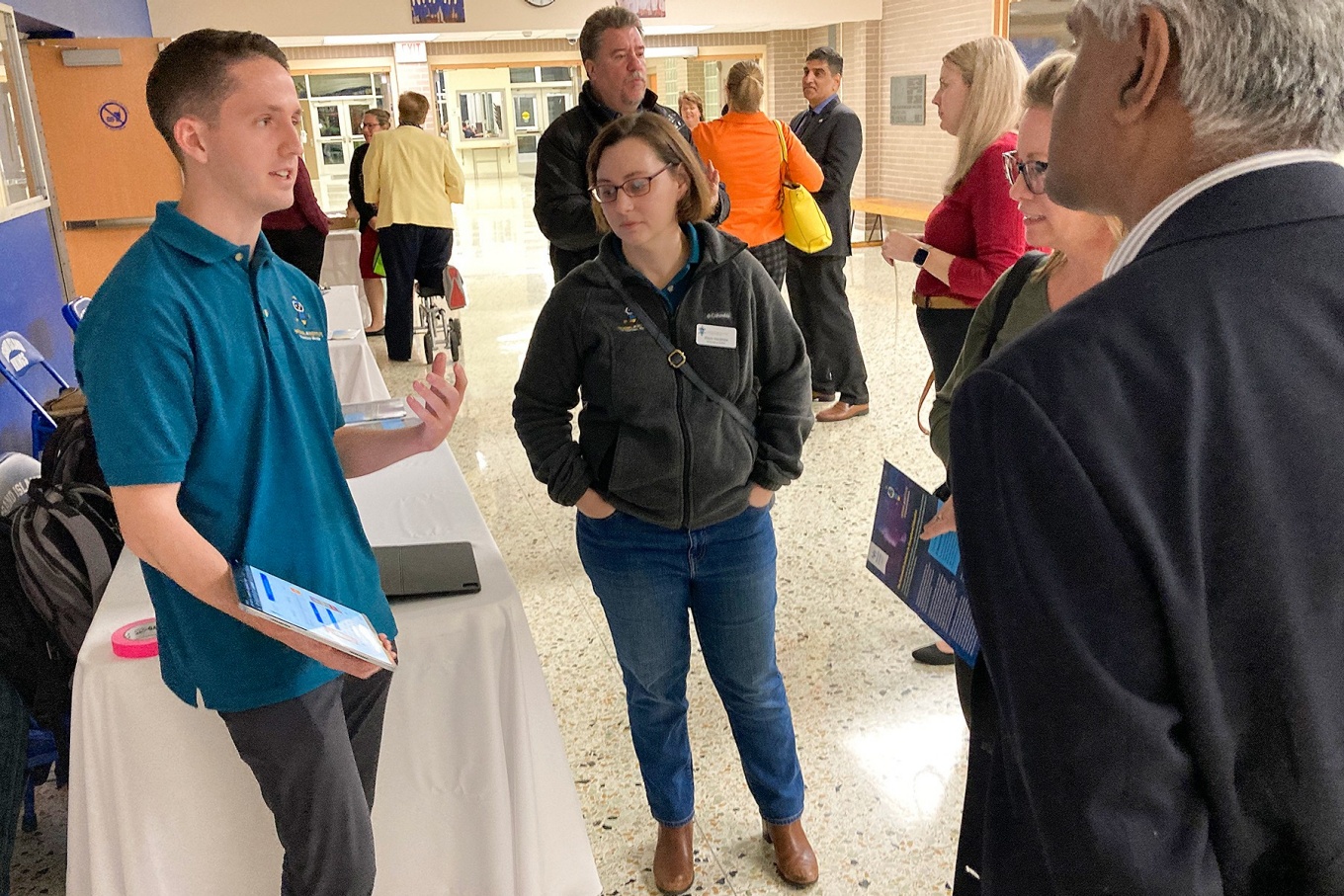 UB Graduate students present research posters following the AI Chat panel discussion held at Grand Island High School. 