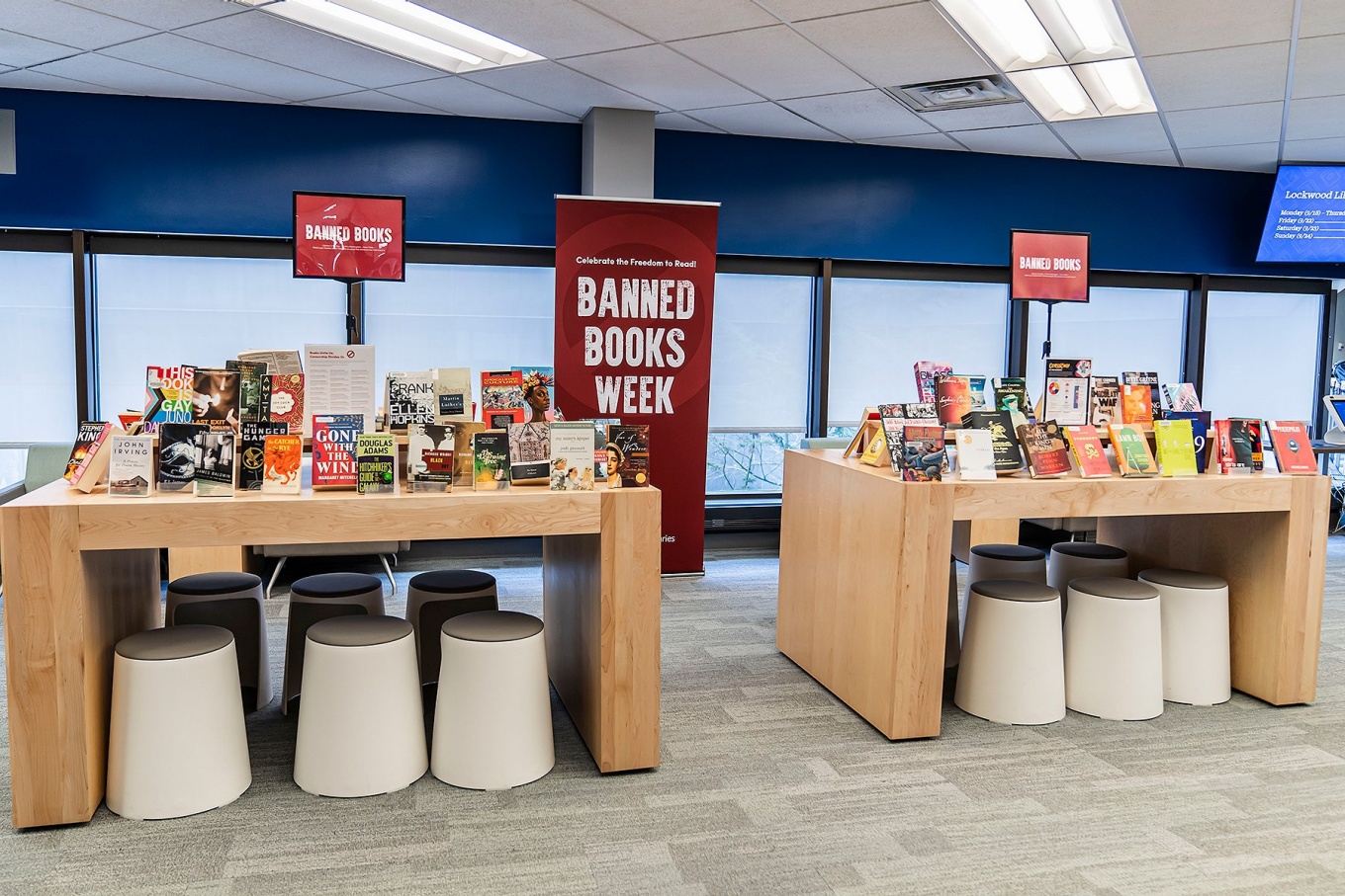 Tables in Lockwood Library displaying a large variety of banned books in celebration of Banned Books Week. 