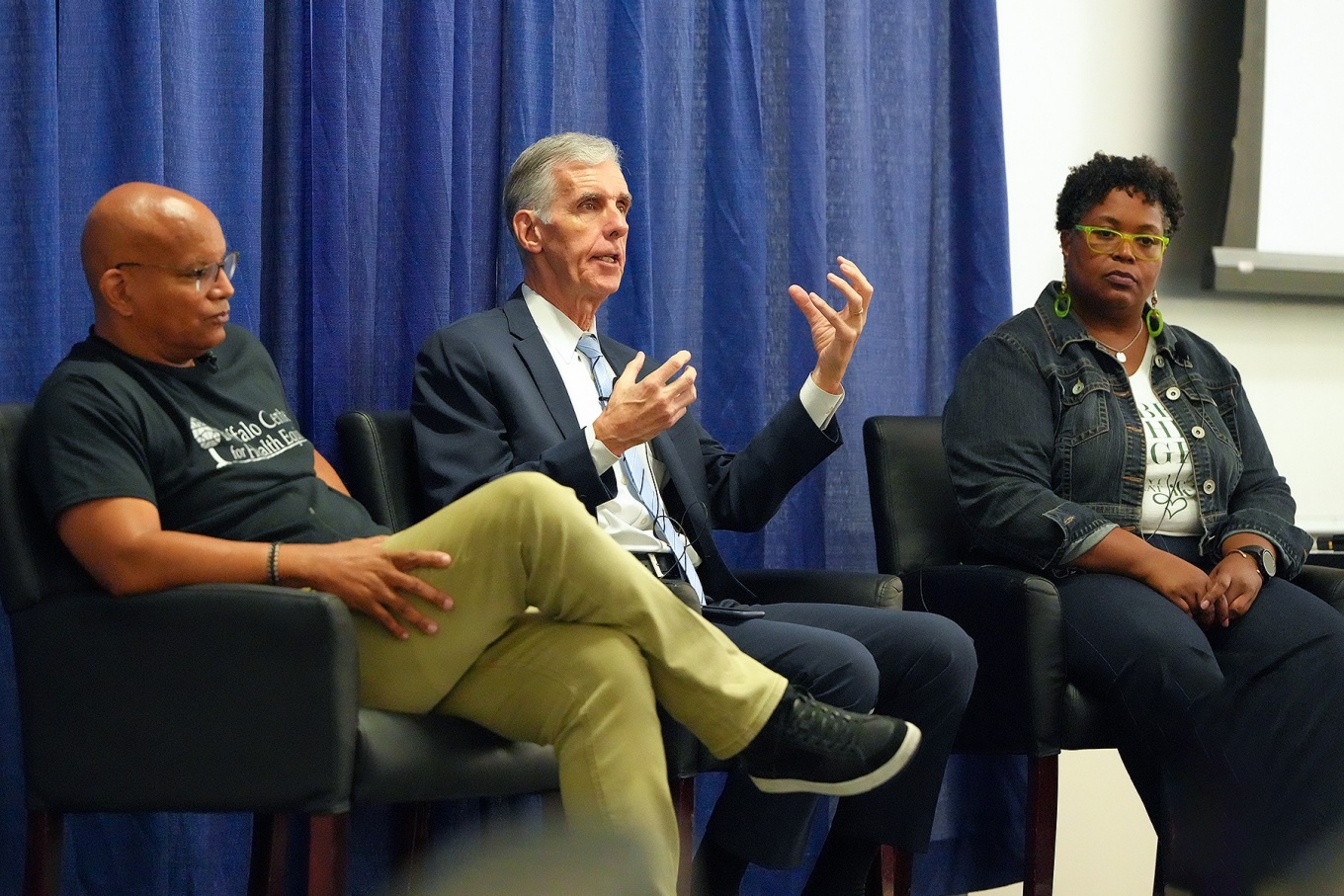 Rev. George Nicholas, Tim Murphey and XX in a panel discussion. 
