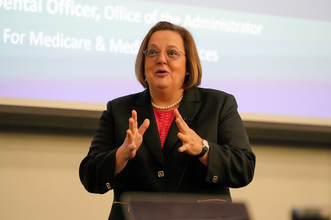 Natalia Chalmers pictured in front of a screen display. 