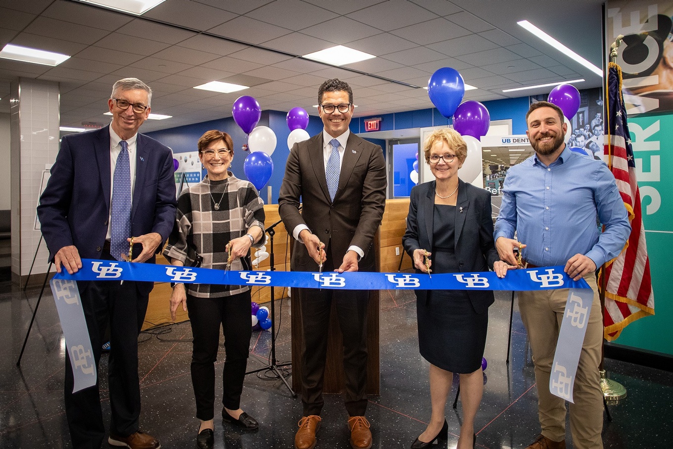 From left, Provost A. Scott Weber, Eugena Stephan, dean Marcelo Araujo, dean Allison Brashear, and Matt Webber cut the ribbon at the specialty dental clinic. 