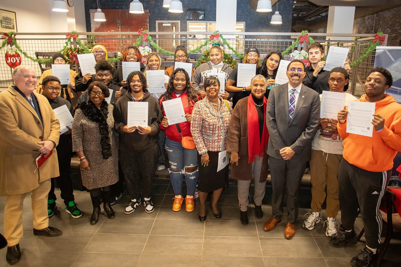 Buffalo Public School seniors pose with SUNY administrators. 