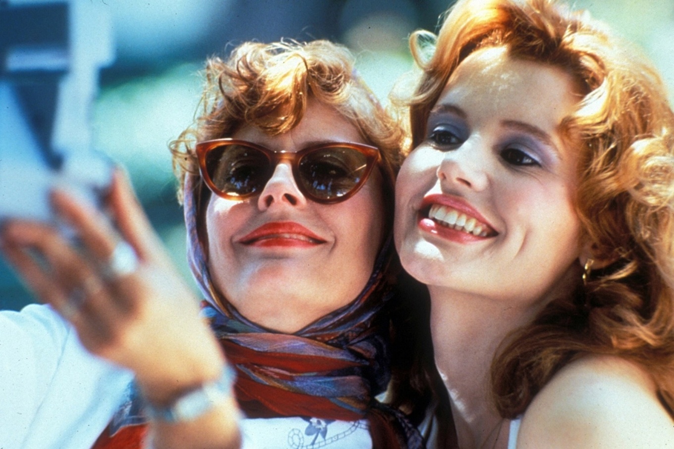 Scene from "Thelma and Louise" of the two women taking a polaroid photo of themselves. 