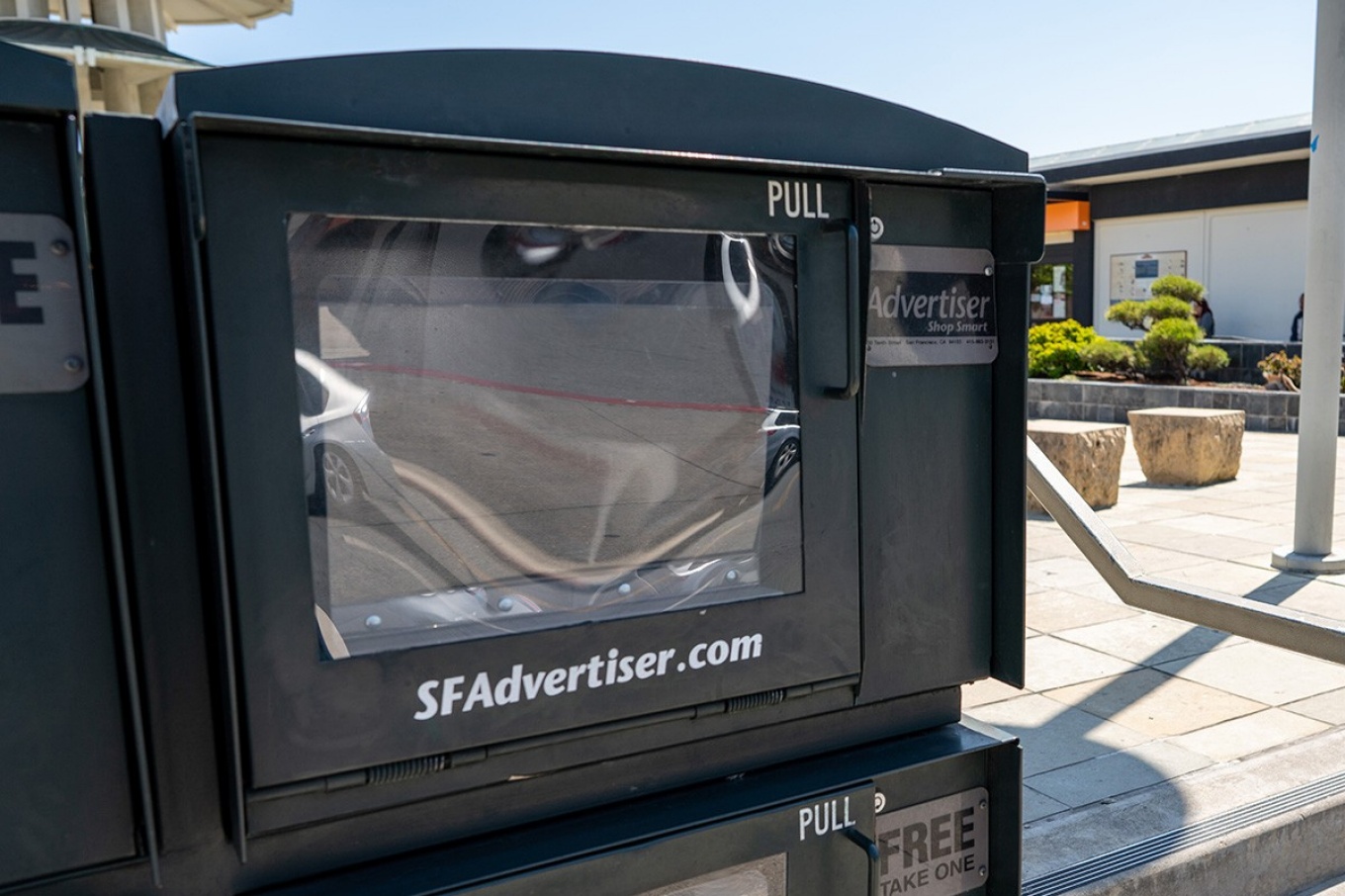 Empty newspaper honor box. 