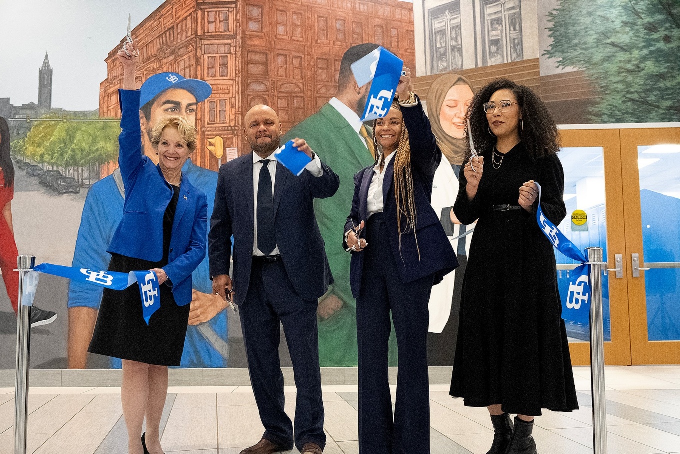 L to R: Allison Brashear, vice president for health sciences and Jacobs School dean; Raul Vazqez, and Toni Gaiter-Vazquez; and artist Julia Bottoms. 