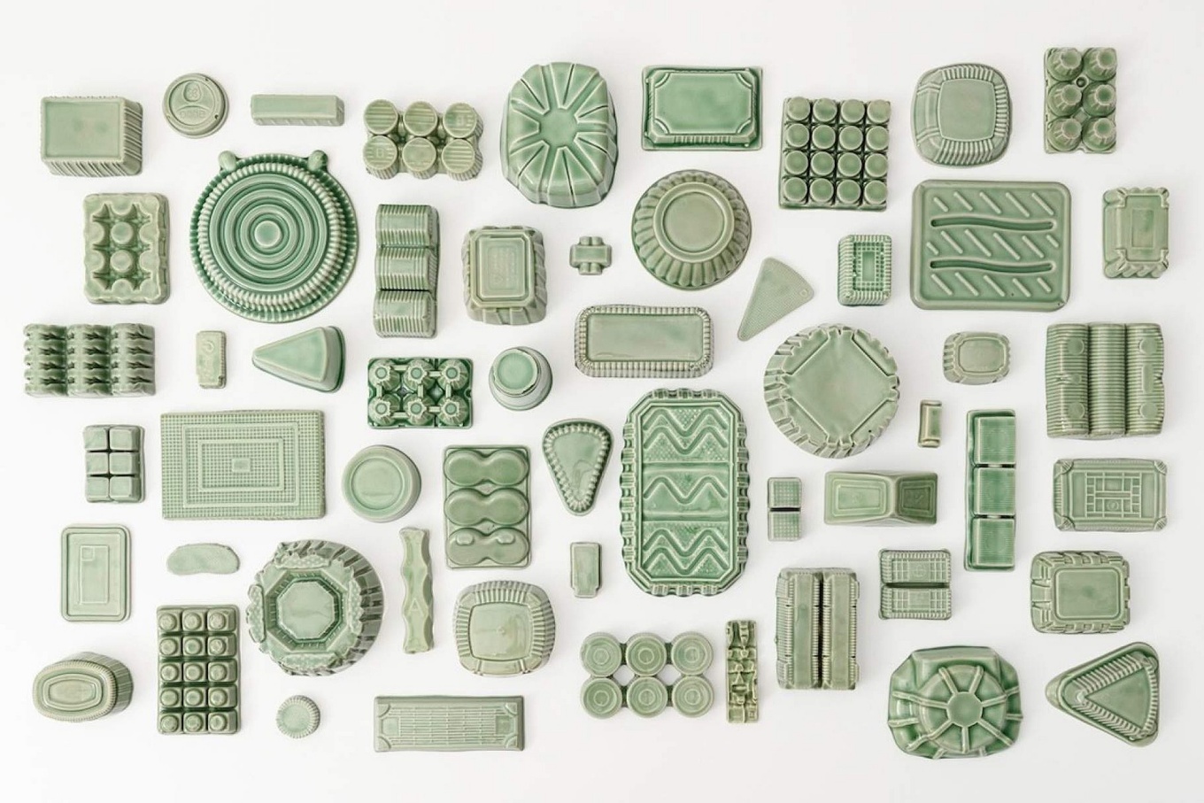 Yoonmi Nam, Keeping, 2022-23. Slip-cast porcelain with celadon glaze, dimensions variable. Courtesy of the artist. 
