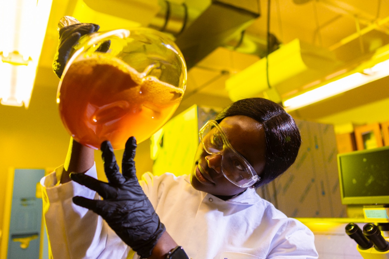 Blessing Ogboo, a graduate student, works in the chemistry lab of David Heppner, in the Natural Sciences Complex (NSC) in February 2024. Photographer: Douglas Levere. 
