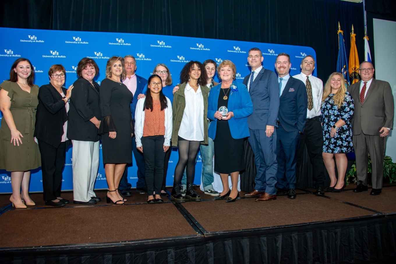 Zoom image: Nancy Nielsen, MD&rsquo;76, with her extended family after receiving the Jacobs School&rsquo;s Distinguished Alumni Award in the fall 2023. 