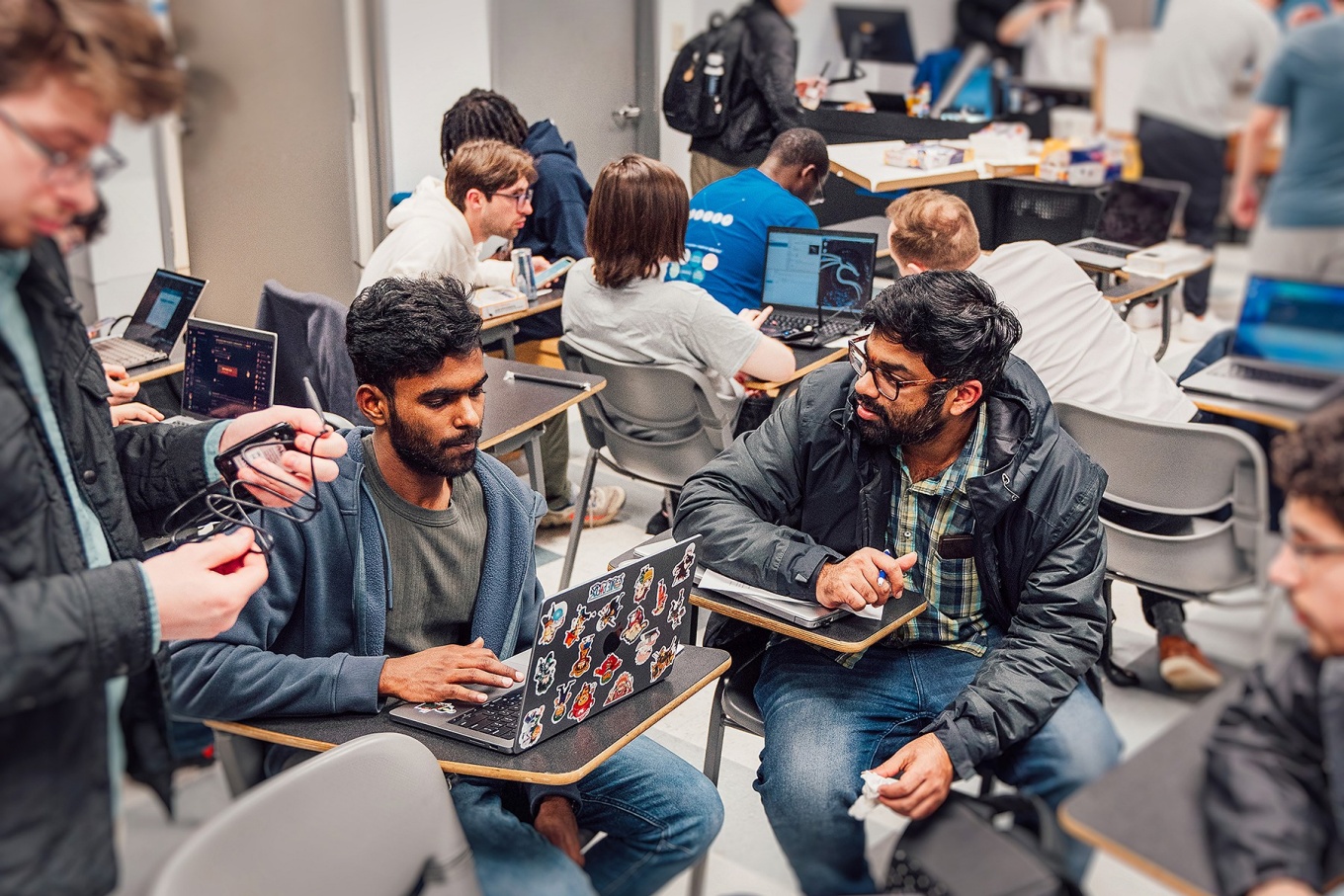Students participating in a cybersecurity wifi hacking exercise.