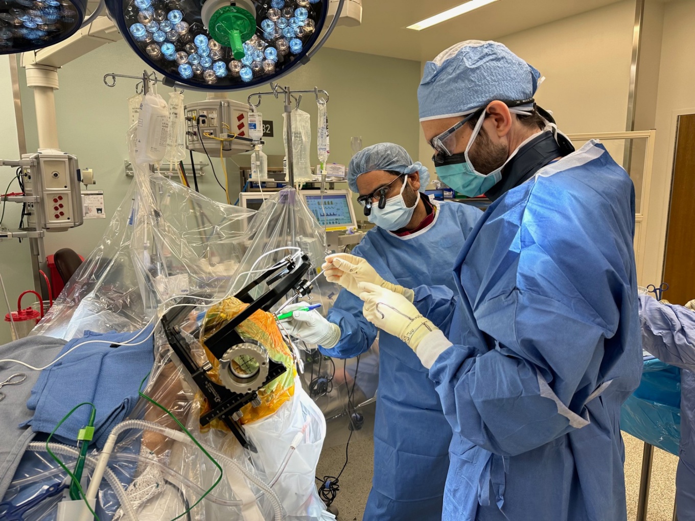 Surgeons in the operating room performing surgery.