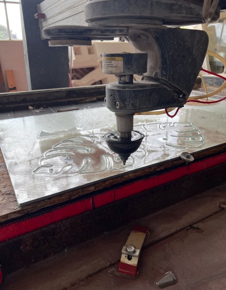 Zoom image: The Fabrication Workshop's five-axis waterjet cutter is among the shop's newest tools. The machine can cut and contour materials from metal to stone using a high-powered, rotating stream of water. Students typically rely on shop staff to operate the machine due to its complex software programming. Photo: Lukas Iverson 