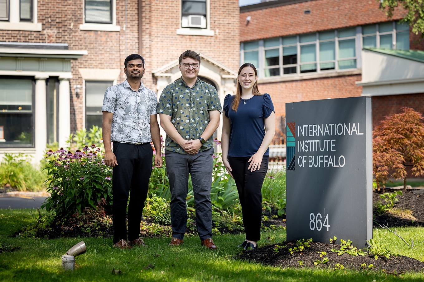 Social Imact Fellows pictured in front of the International Institute Buffalo. 