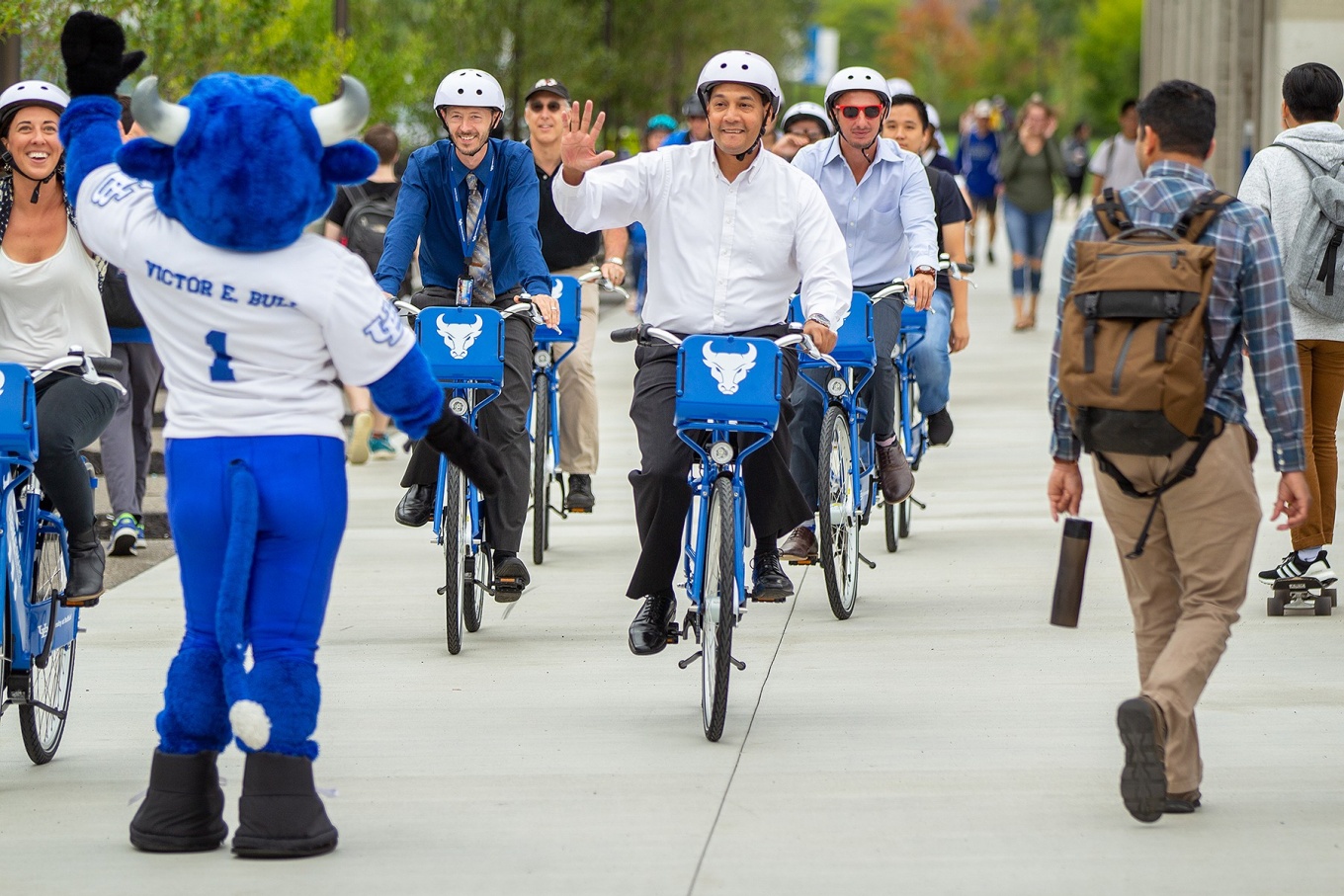 UB community members riding bikes during a bike share event. 