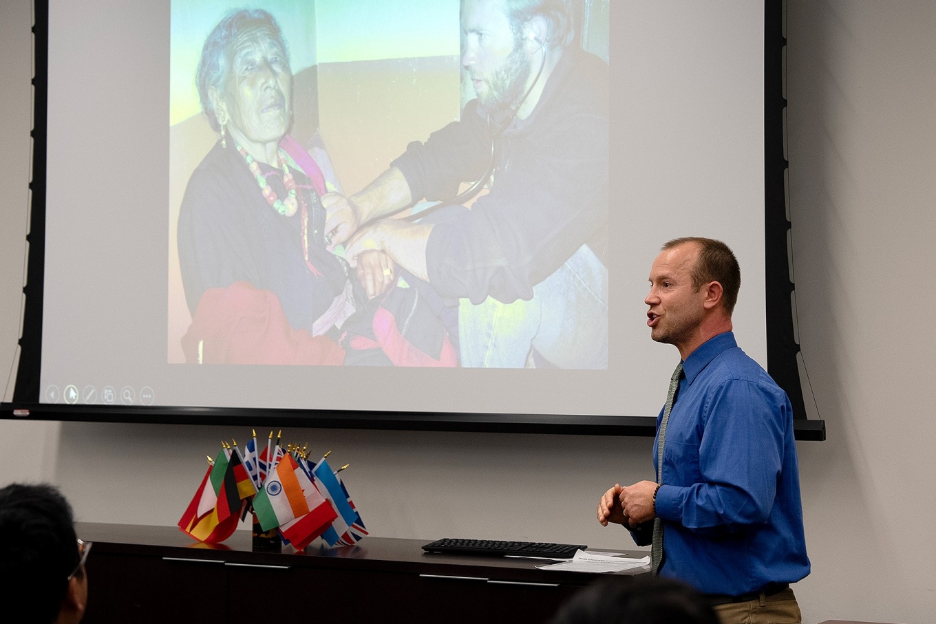Shawn Vainio gives a presentation about his experience in wilderness medicine during the 2024 Global Health Grand Rounds. 