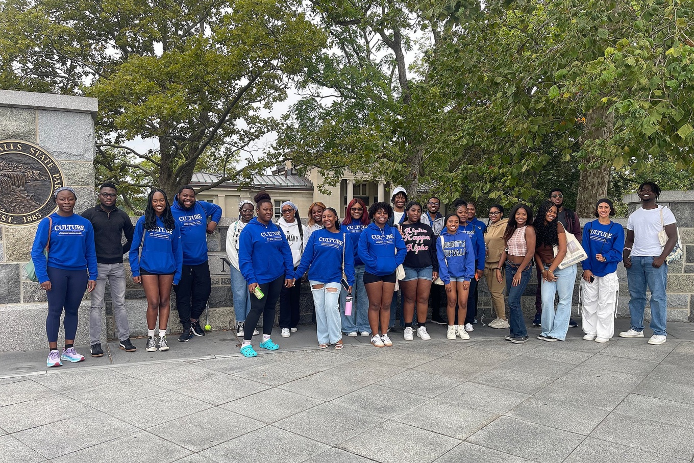 CULTURE students in a large group at Niagara Falls State Park entrance. 