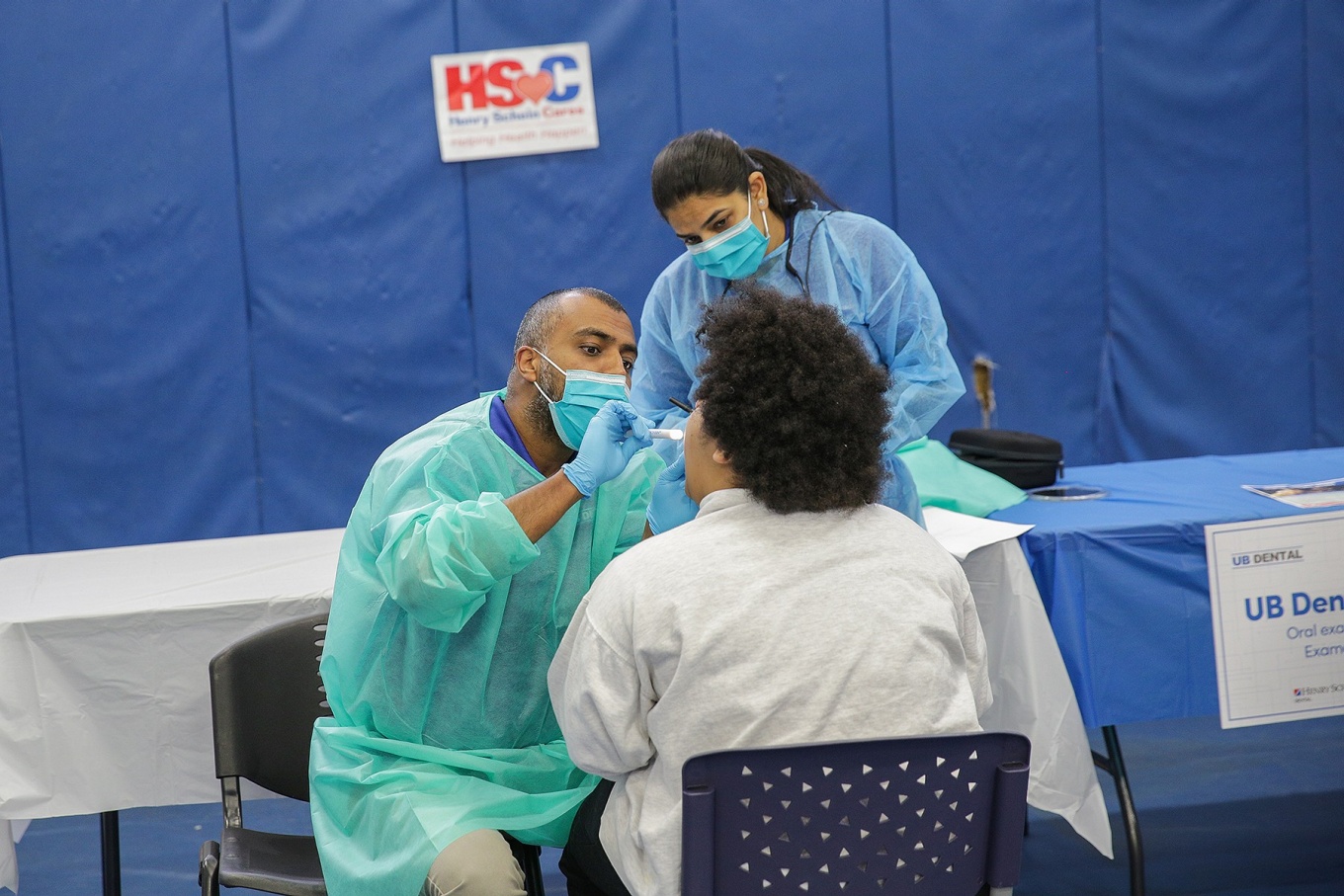 Joshua Matam participates in UB Dental Day at The Belle Center providing free dental treatment to West Side adolescents and their families.